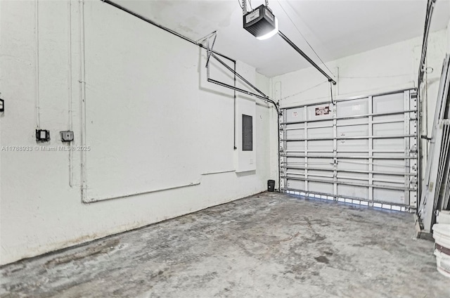 garage featuring electric panel and a garage door opener