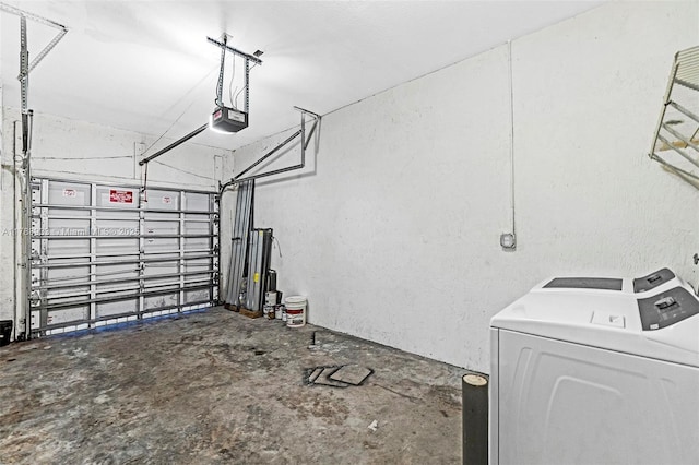 garage featuring a textured wall, a garage door opener, and washer / clothes dryer