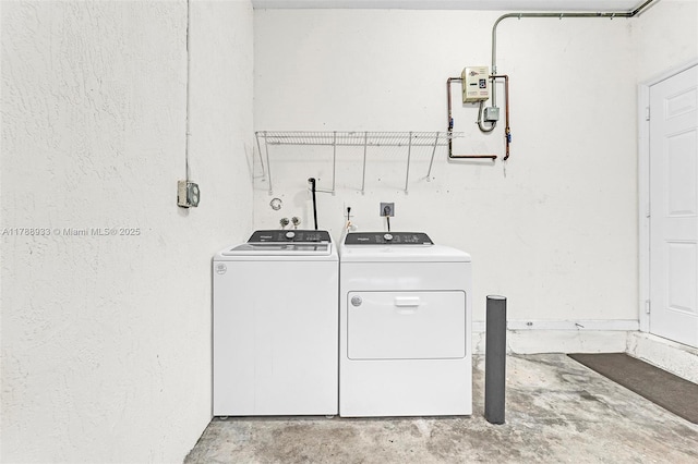clothes washing area with laundry area and independent washer and dryer