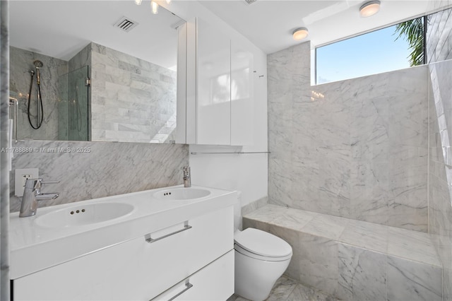 1600 Michigan Ave Unit 7, Miami Beach, FL 33139 - full bathroom with a shower, toilet, double vanity, and tile walls