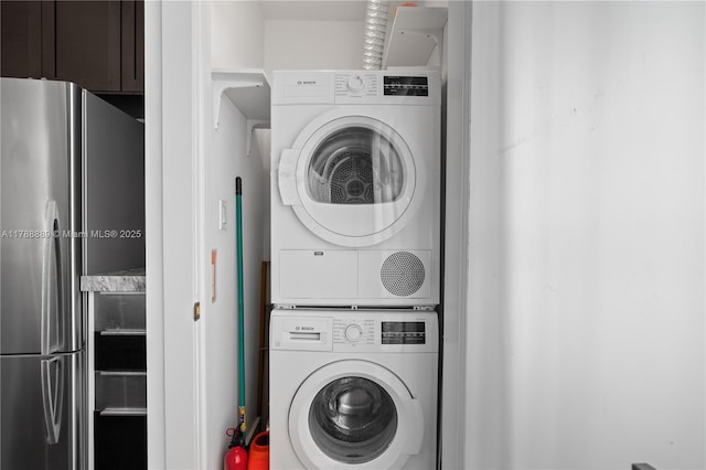 1600 Michigan Ave Unit 7, Miami Beach, FL 33139 - clothes washing area featuring stacked washing machine and dryer