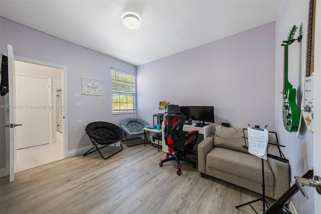 office with wood finished floors and baseboards
