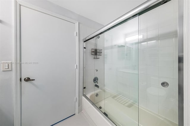 full bath with combined bath / shower with glass door