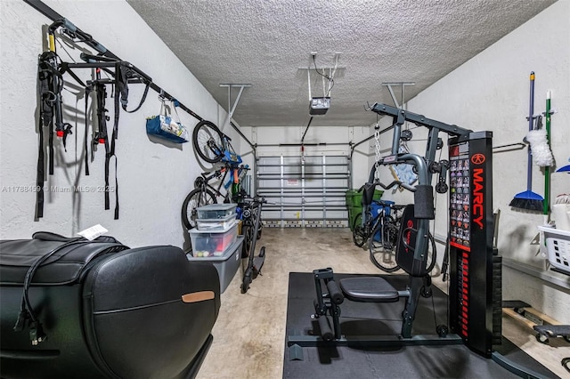 garage featuring a textured wall and a garage door opener