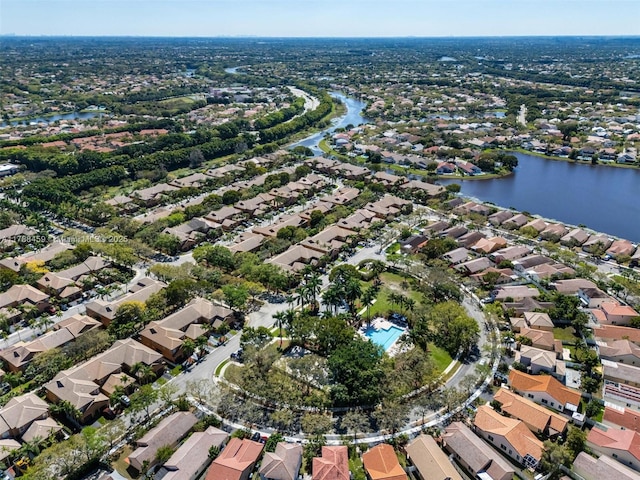 drone / aerial view featuring a water view and a residential view
