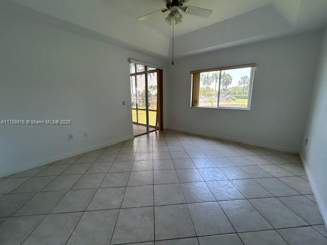 7911 W Exeter Blvd W Unit A101, Tamarac, FL 33321 - spare room with ceiling fan, light tile patterned flooring, and baseboards