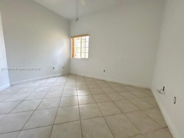 7911 W Exeter Blvd W Unit A101, Tamarac, FL 33321 - spare room with light tile patterned floors and baseboards