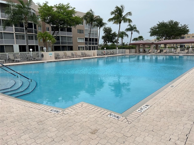 7911 W Exeter Blvd W Unit A101, Tamarac, FL 33321 - community pool with a patio
