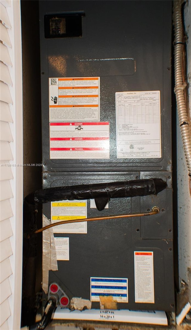 utility room featuring heating unit