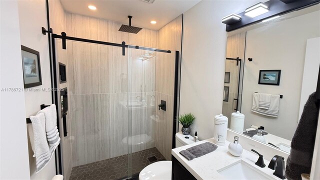 11657 NW 11th St, Pembroke Pines, FL 33026 - bathroom featuring toilet, vanity, a stall shower, and recessed lighting