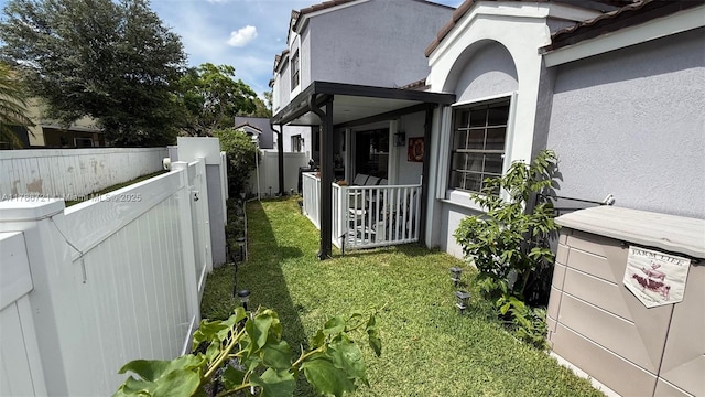 11657 NW 11th St, Pembroke Pines, FL 33026 - view of property exterior with stucco siding and a gate