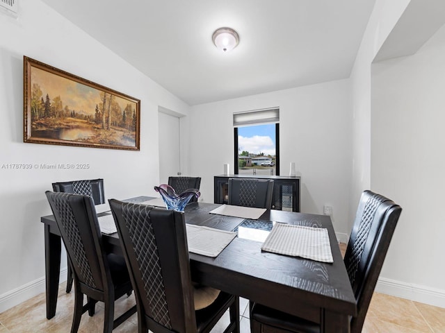 dining space featuring visible vents, baseboards, and light tile patterned floors