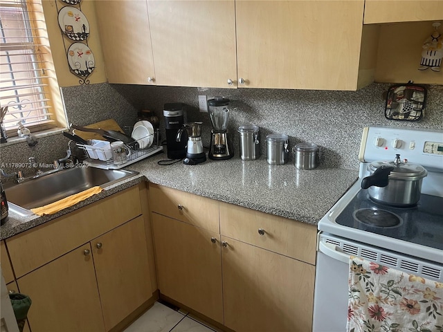 10851 SW 2nd St Unit K304, Sweetwater, FL 33174 - kitchen with electric range, backsplash, light brown cabinetry, and a sink