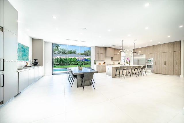 dining space with wooden walls and recessed lighting