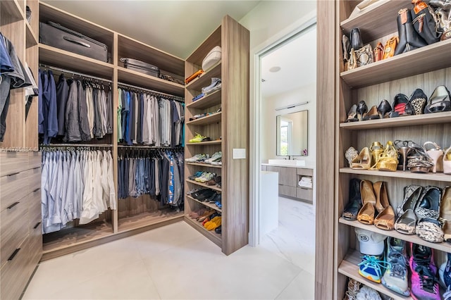 spacious closet featuring a sink