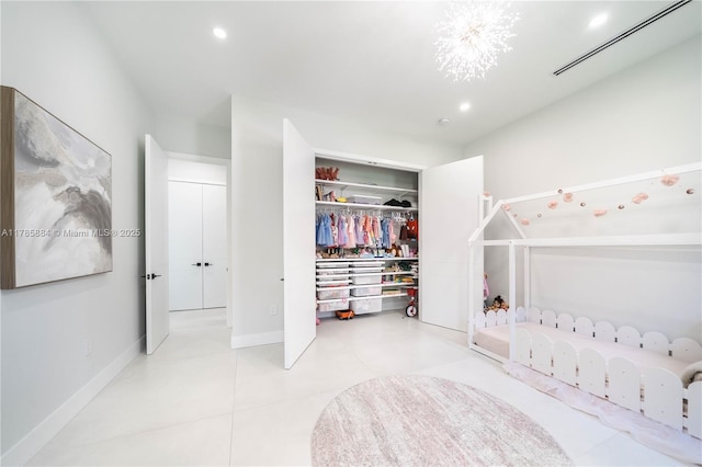 unfurnished bedroom featuring recessed lighting, a closet, tile patterned floors, and visible vents
