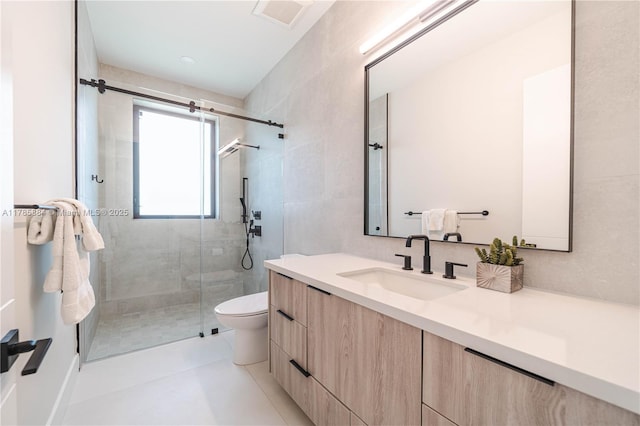 full bathroom featuring a shower stall, toilet, vanity, and visible vents
