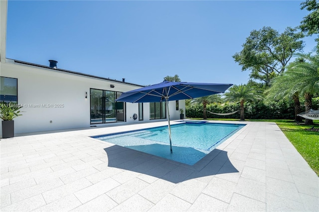outdoor pool featuring a patio