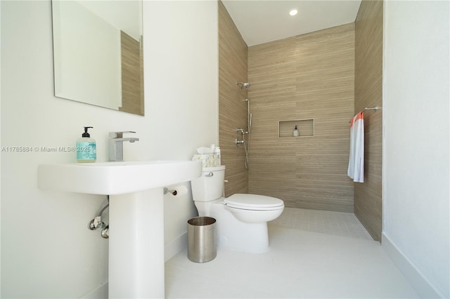 full bath featuring tile patterned flooring, toilet, tiled shower, and recessed lighting