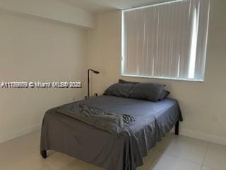 1861 NW S River Dr Unit 1602, Miami, FL 33125 - bedroom featuring tile patterned floors and baseboards