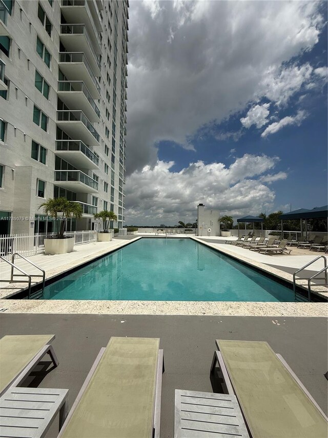 1861 NW S River Dr Unit 1602, Miami, FL 33125 - community pool featuring fence and a patio area