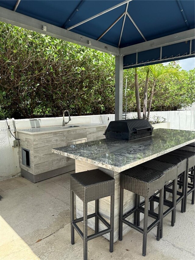 1861 NW S River Dr Unit 1602, Miami, FL 33125 - view of patio with exterior kitchen, a grill, and a gazebo