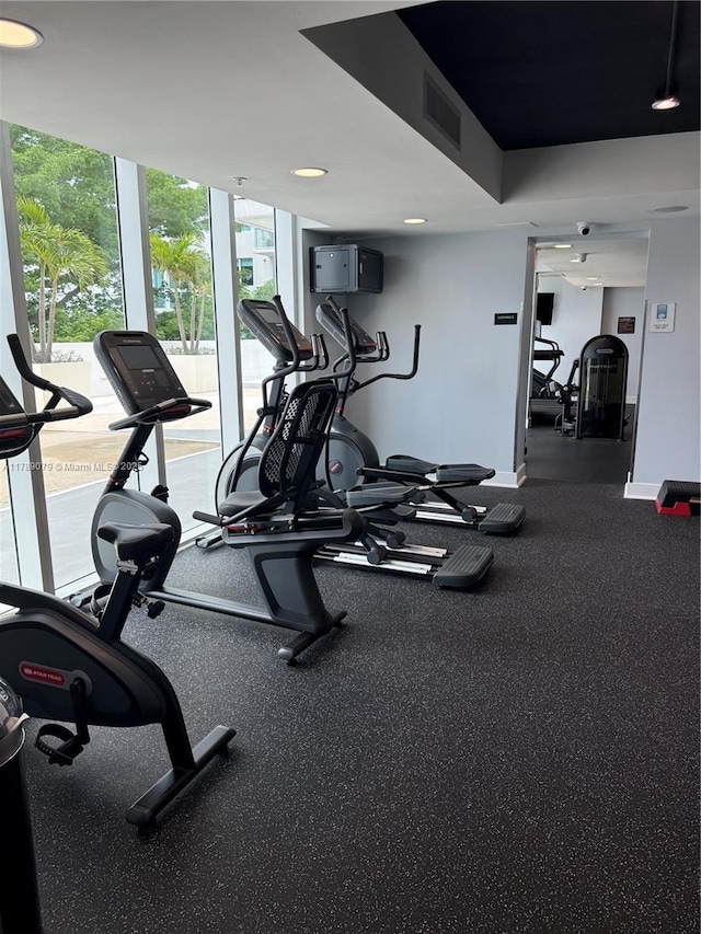 1861 NW S River Dr Unit 1602, Miami, FL 33125 - workout area with baseboards, recessed lighting, and floor to ceiling windows