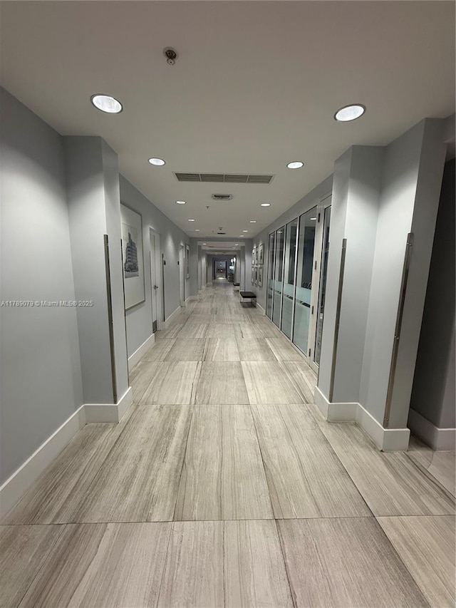 1861 NW S River Dr Unit 1602, Miami, FL 33125 - hall featuring baseboards, light wood-style flooring, and recessed lighting