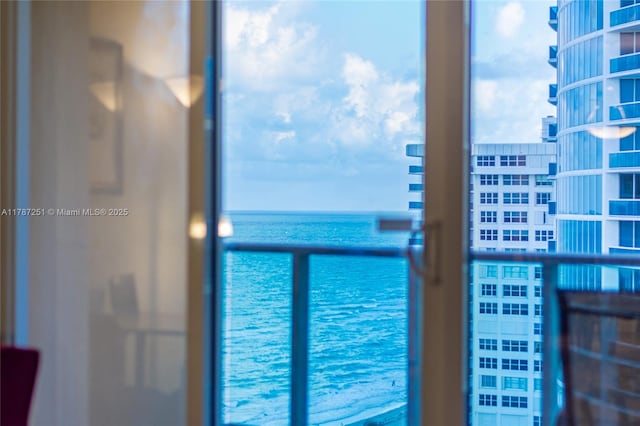 balcony featuring a water view