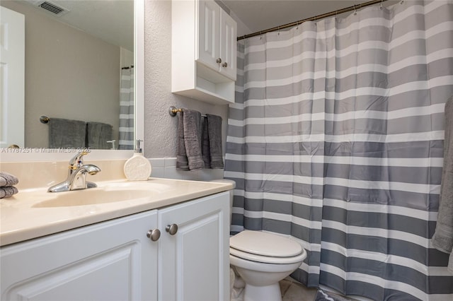 full bath with a shower with curtain, toilet, a textured wall, vanity, and visible vents