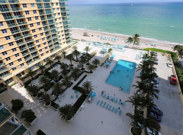birds eye view of property featuring a water view and a view of the beach