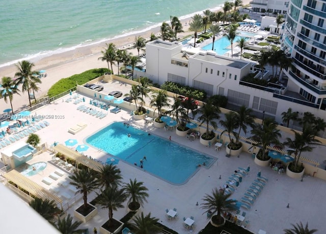 bird's eye view featuring a view of the beach and a water view