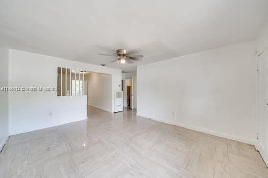 empty room featuring ceiling fan