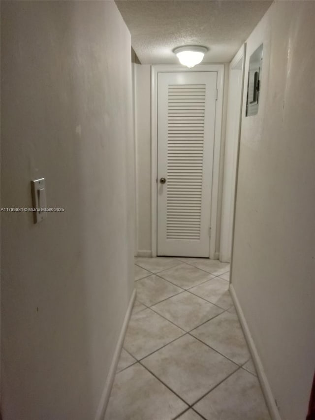 6510 Winfield Blvd Unit 103, Margate, FL 33063 - hallway with a textured ceiling and light tile patterned floors