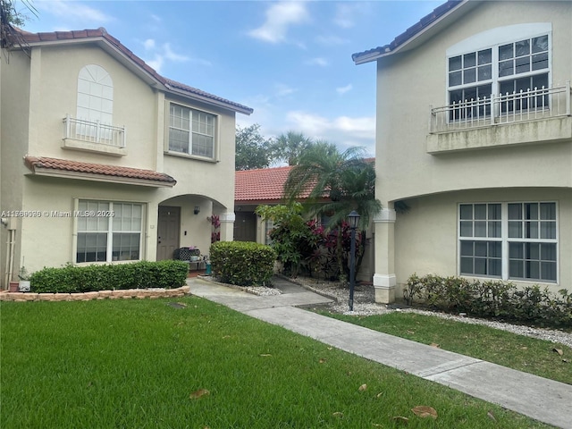 111 NW 108th Ave, Pembroke Pines, FL 33026 - view of front of home with stucco siding, a tile roof, and a front lawn