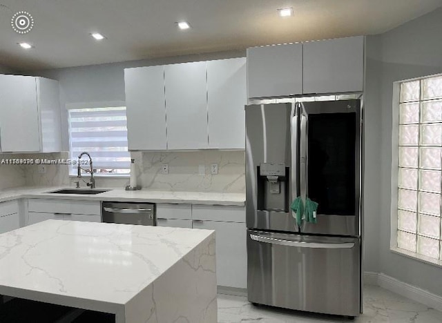111 NW 108th Ave, Pembroke Pines, FL 33026 - kitchen featuring marble finish floor, a sink, appliances with stainless steel finishes, and tasteful backsplash