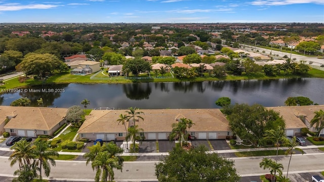 aerial perspective of suburban area with a nearby body of water
