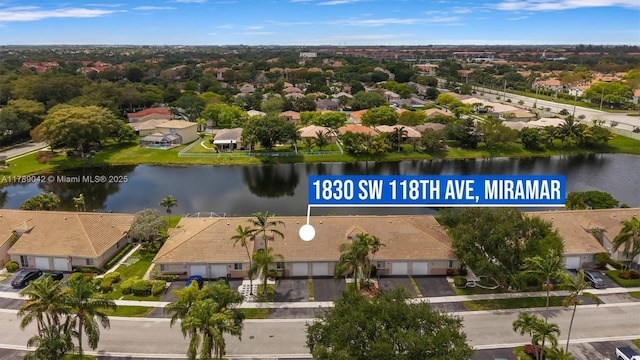 aerial view of residential area with a large body of water
