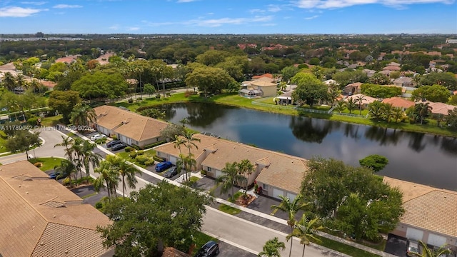 aerial view of residential area featuring a nearby body of water