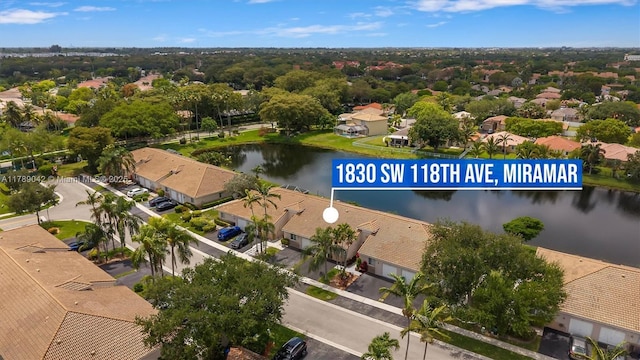 aerial perspective of suburban area featuring a nearby body of water