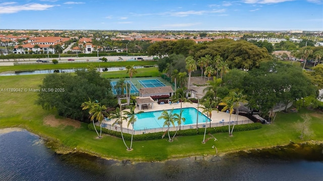 aerial view of a pool and a nearby body of water