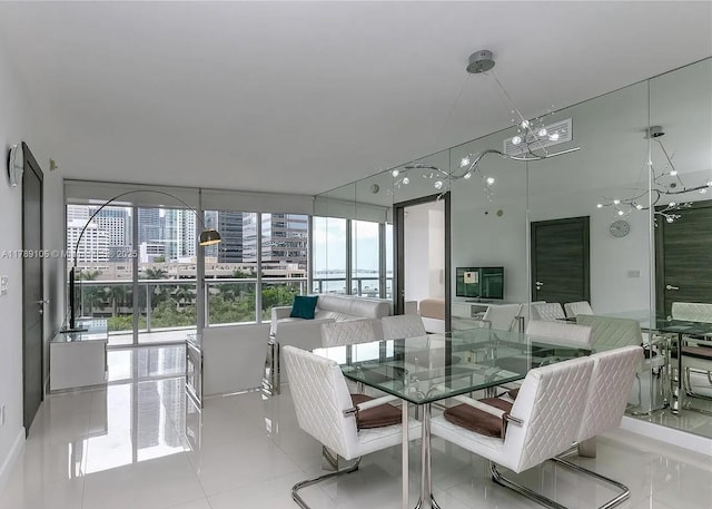 dining space featuring a city view, plenty of natural light, and an inviting chandelier