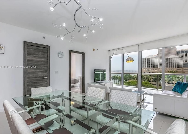 dining area with expansive windows and tile patterned flooring