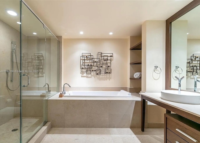 bathroom with a bath, a stall shower, recessed lighting, tile patterned flooring, and vanity