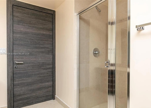 full bath featuring a shower stall