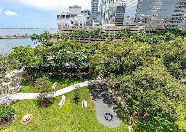 birds eye view of property featuring a city view and a water view