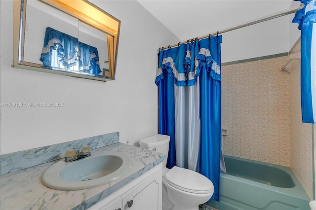 full bathroom featuring shower / tub combo with curtain, toilet, and vanity