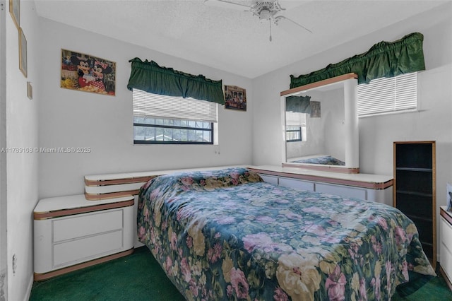 bedroom featuring a ceiling fan and carpet