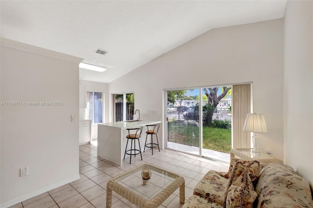 14214 SW 177th Ter, Miami, FL 33177 - living area with baseboards, visible vents, high vaulted ceiling, and light tile patterned floors