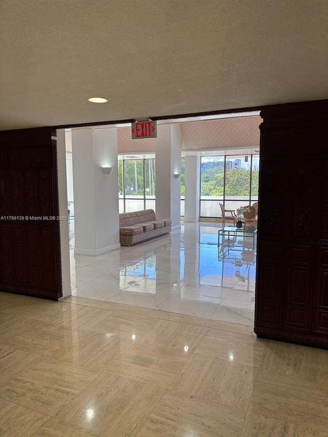500 Three Islands Blvd Unit 313, Hallandale Beach, FL 33009 - hall featuring baseboards and light tile patterned flooring